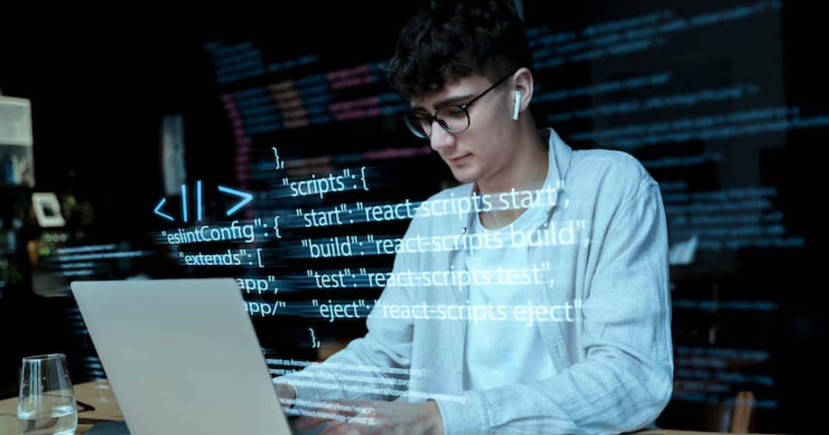 A young programmer wearing glasses and earbuds working on a laptop with code overlays displayed in the foreground.